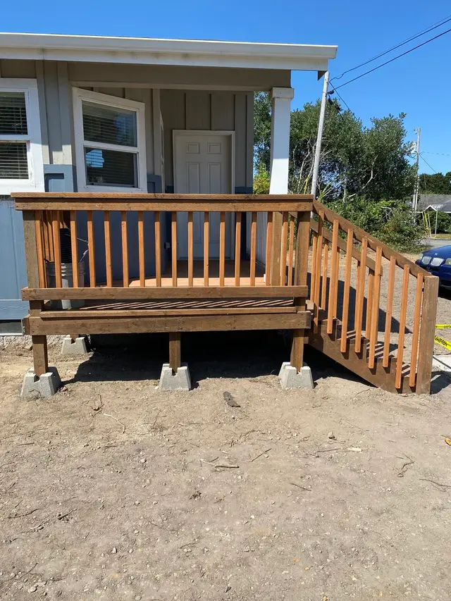 Front porch deck build with wood railing and stairs in Coos Bay OR – Premier Coastal Construction