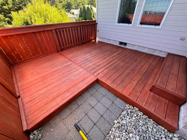 Stained redwood deck with railing and paver patio in Coos Bay OR – Premier Coastal Construction