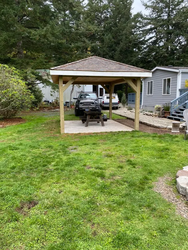 Custom covered pavilion with shingled roof in North Bend OR – Premier Coastal Construction